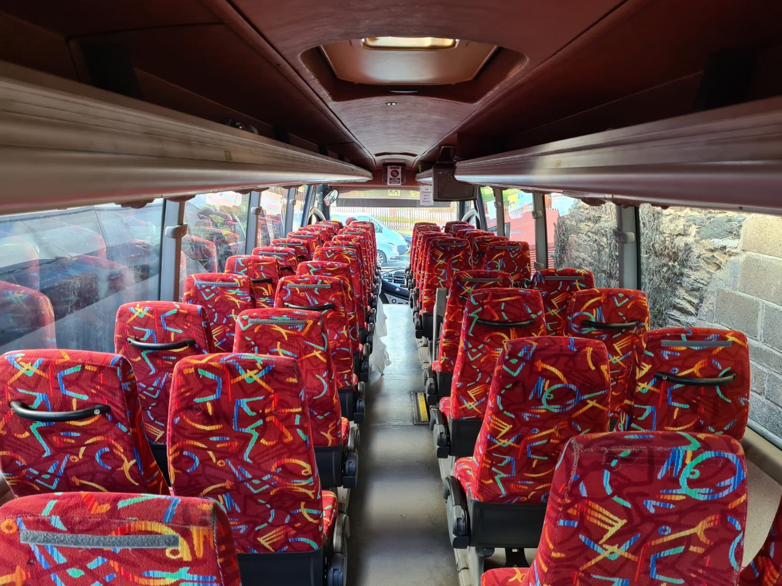Premium red interior of the Syste coach