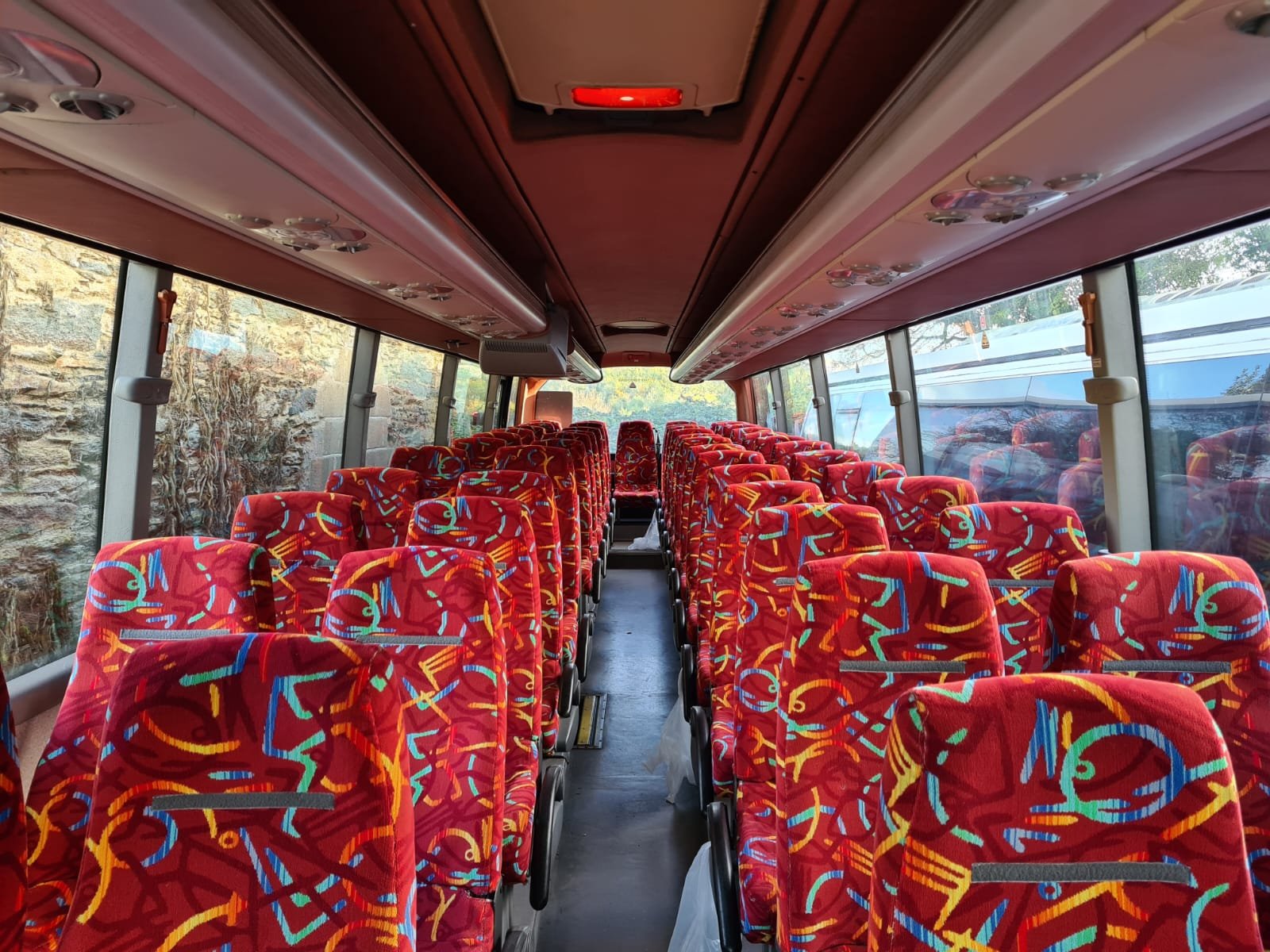 Modern Syste coach on Irish country lane front view