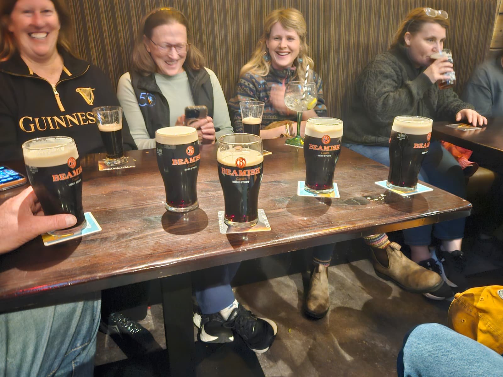 Group enjoying pints on a Paynes trip